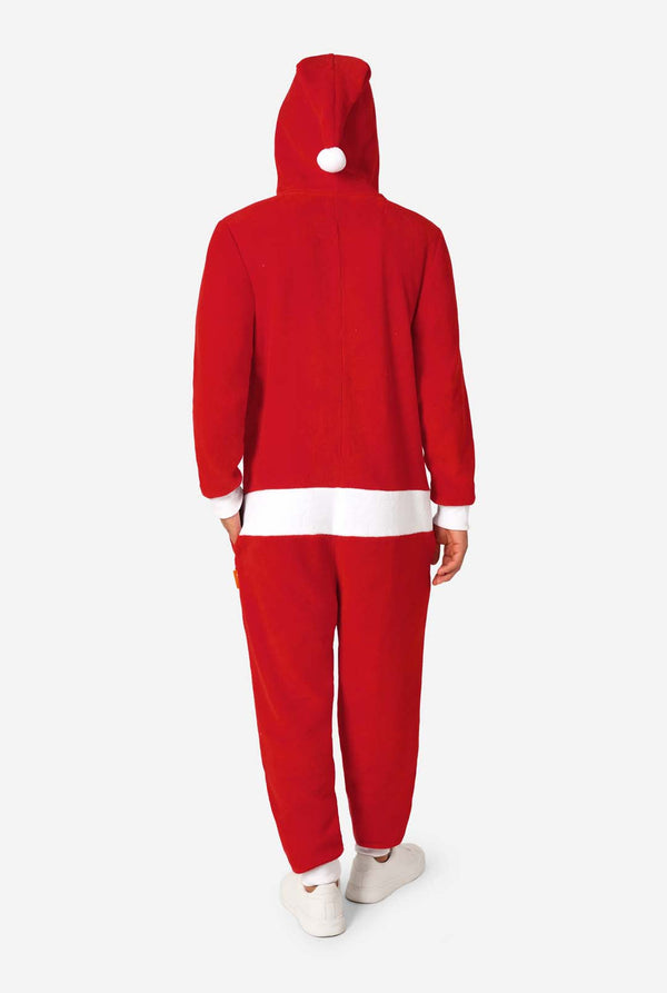 A smiling man models a cozy, red and white, hooded christmas onesie that resembles a Santa onesie. View from the back