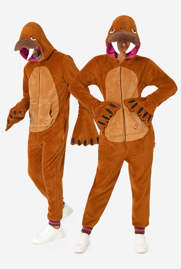 A cheerful man and women are wearing a brown adult onesie designed as a walrus. The onesie features a hood with fangs, stitched gloves resembling paws, and playful walrus details, perfect for cozy lounging or costume parties. The hood are on their heads. Full body image.