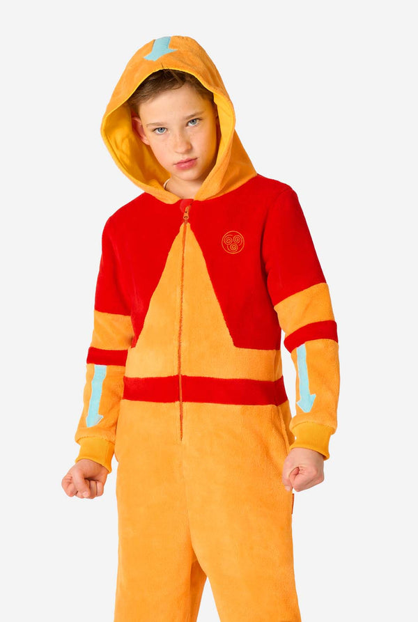 Child wearing a red and orange Aang onesie with a hood on a white background