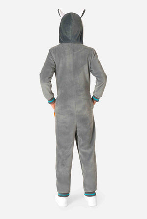 Child wearing a cozy unisex kids onesie designed as a lemur, featuring grey and white plush fabric, a hood with a cartoon lemur face and ears, and a playful banana print on the pocket. View of the back of the onesie.