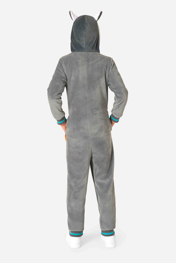 Child wearing a cozy unisex kids onesie designed as a lemur, featuring grey and white plush fabric, a hood with a cartoon lemur face and ears, and a playful banana print on the pocket. View of the back of the onesie.