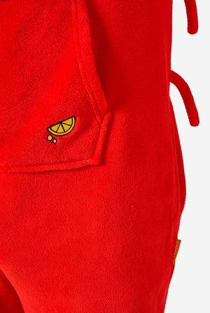 A kid is wearing a bright red lobster-themed kids onesie featuring playful hood details and cozy, soft material. Close up.