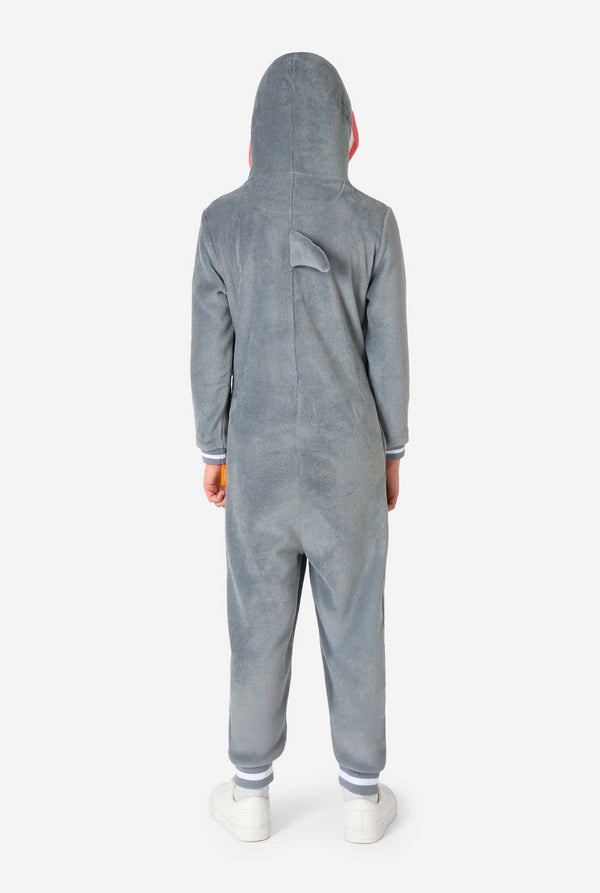 Rear view of a child in a shark-themed onesie, highlighting the grey plush fabric and small back fin in the center.