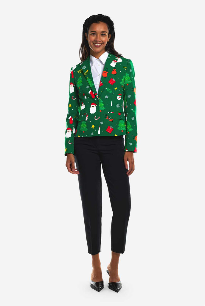 Woman wearing green Christmas blazer for women, with Christmas icons on it.