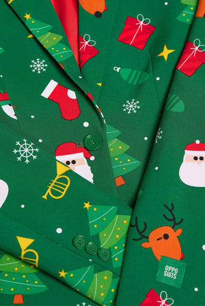 Woman wearing green Christmas blazer for women, with Christmas icons on it.