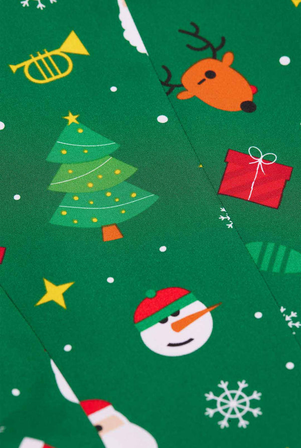 Woman wearing green Christmas blazer for women, with Christmas icons on it.