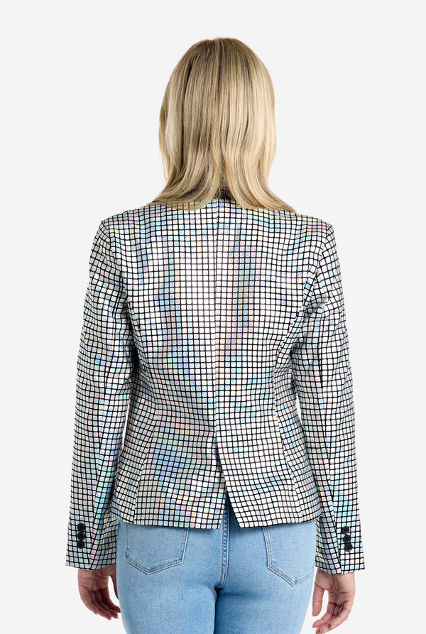 Person wearing a checkered discoball blazer and blue jeans on a white background