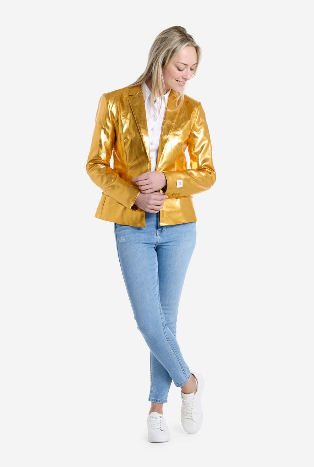 Woman wearing a shiny gold blazer over a white shirt on a white background