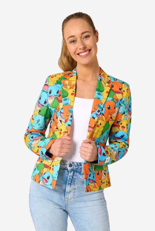 Women wearing a multi colored pokemon blazer, featuring characters such as pikachu, squirtle, charmander and bulbasaur. Holding the jacket and smiling in the camera.