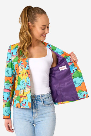 Women wearing a multi colored pokemon blazer, featuring characters such as pikachu, squirtle, charmander and bulbasaur. Holding one side of the blazer open.
