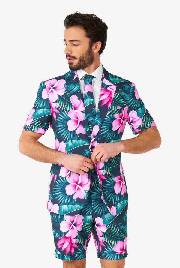 Man wearing blue summer suit with pink flowers in Hawaiian print