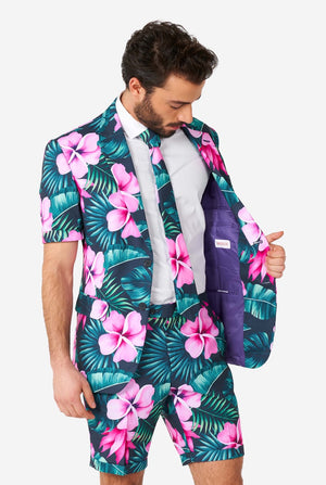 Man wearing blue summer suit with pink flowers in Hawaiian print