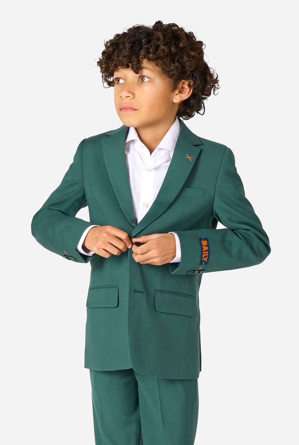 Kid wearing a stylish dark green suit with a white dress shirt, looking away from the camera. Perfect formal outfit for boys' special occasions, weddings, and parties.