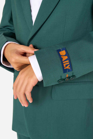 Kid wearing a stylish dark green suit with a white dress shirt, looking away from the camera. Perfect formal outfit for boys' special occasions, weddings, and parties. Sleeve close up.