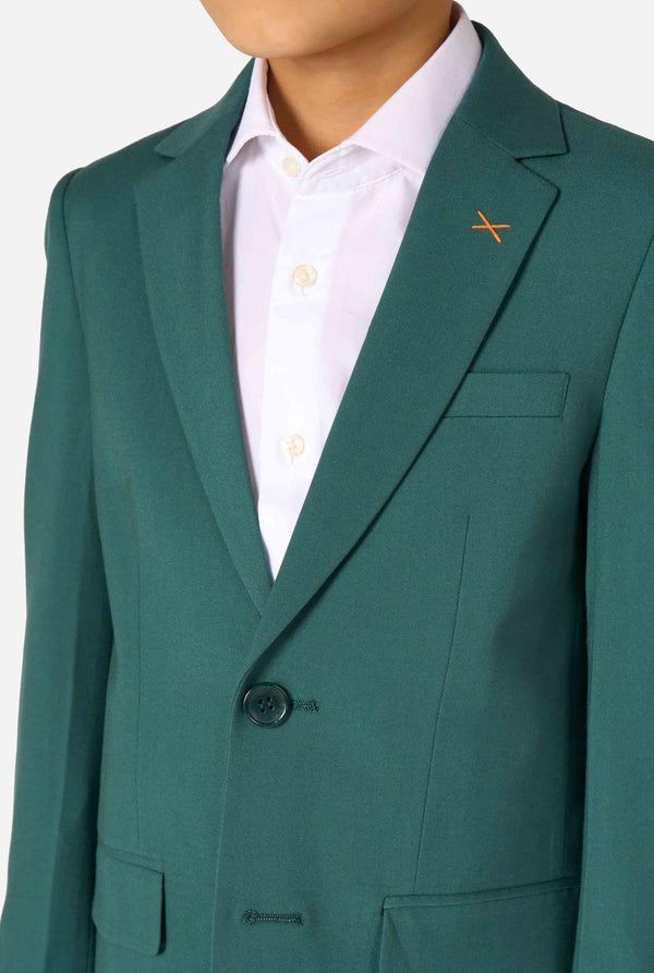 Kid wearing a stylish dark green suit with a white dress shirt, looking away from the camera. Perfect formal outfit for boys' special occasions, weddings, and parties. Chest close up.