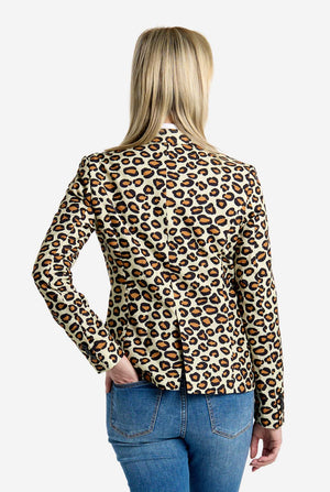 Person wearing a leopard print shirt and blue jeans on a white background