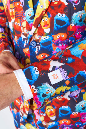 Man wearing men's suit with Sesame street characters print, sleeve close up