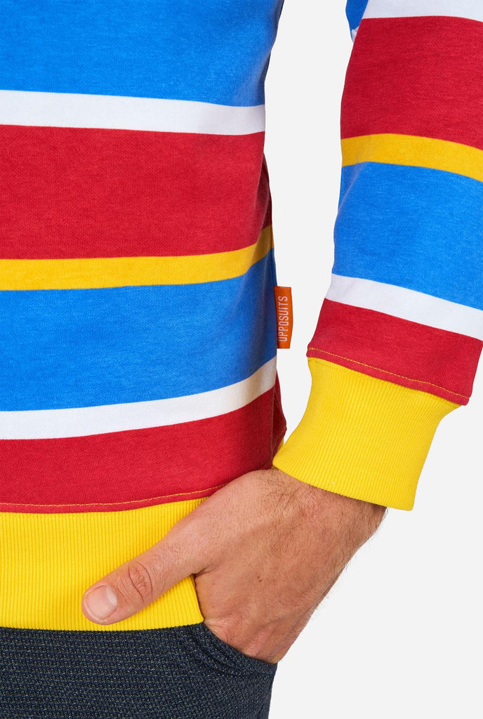 Man wearing Men's Sweater with iconic Sesame Street Ernie pattern with Yellow, red, blue and white stripes, close up