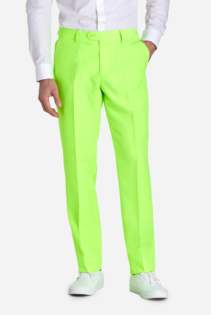 Man wearing neon lime green colored suit, pants view
